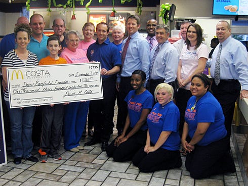 Drew Barefield and his family are joined by friends, supporters and McDonald’s owners and management as Costa Enterprises presents a check toward Drew’s medical expenses.