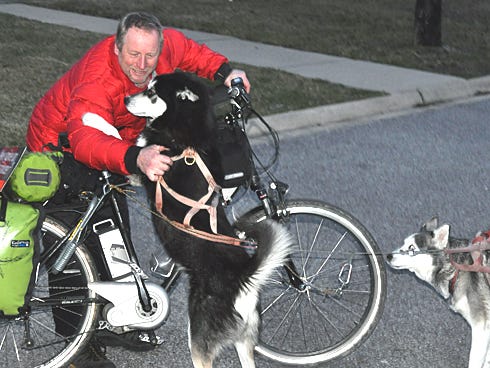 Randolph Westphal — pictured Monday evening at the Quality Inn in Crestview with his Siberian huskies, Chinook, left, and Nanook — is on a journey of hope throughout Florida.