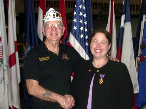 Region IV Cmdr. Bill Everett congratulates Meredith McQuagge, the Niceville Military Order of the Purple Heart’s first female chapter commander, March 16. The chapter has a number of members in Crestview, Baker and Laurel Hill.