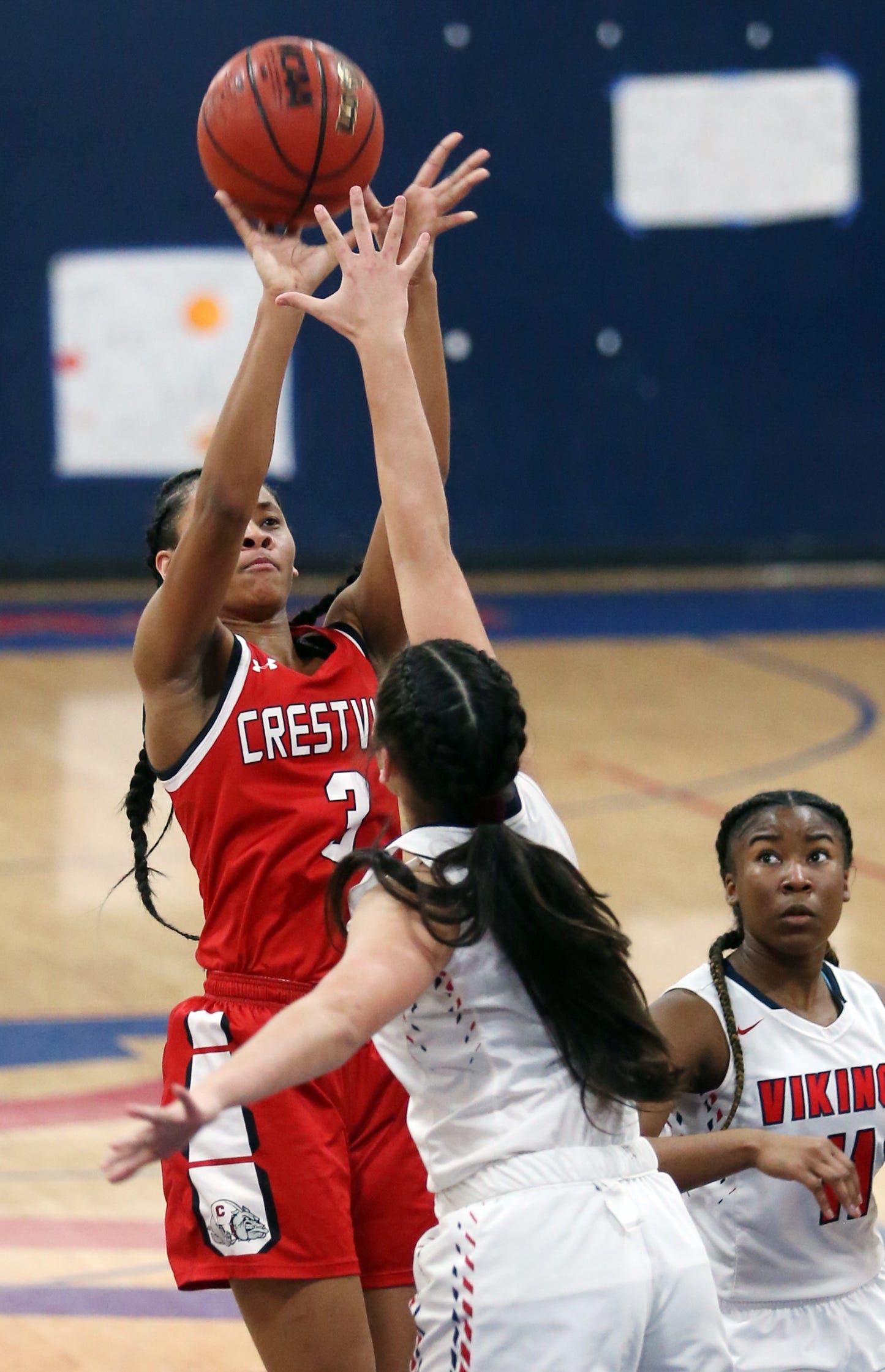 Crestview's Marissa Brown puts up a shot over Fort Walton Beach's Madison Seiuli during the Lady Bulldogs win over the Lady Vikings at Fort Walton Beach. [FILE PHOTO]