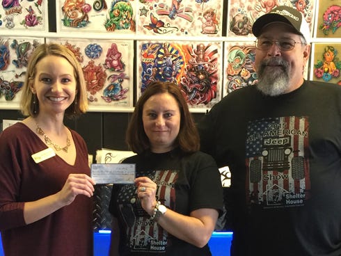 Shelter House Executive Director Rosalyn Iovieno, left, accepts a $12,514 check from All American Jeep Club Vice President Shelly Tibbs and President Jeff Bullard Nov. 6. The money, which came from the All American Jeep Show in September, will support Okaloosa and Walton counties' domestic and sexual violence victims.