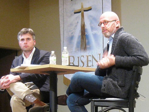 The Rev. Michael Precht, left, listens, as Alan Chambers, former president of Exodus International, replies to an audience member's question during the first of three “Fearless Conversations” about gay Christians.