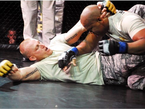 Crestview native Staff Sgt. Matthew McKeon Sr., left — an infantryman with the 2nd Lancer Battalion, 5th Cavalry Regiment, 1st Ironhorse Brigade Combat Team, 1st Cavalry Division — prepares to punch his opponent during the championship bout of the Fort Hood Combatives Tournament Feb. 23 at Fort Hood, Texas.