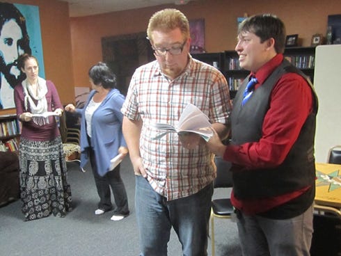 Sean Peters, second from right, and Jack Barr rehearse a scene from “Arsenic and Old Lace” as Ashleigh Gonyea, left, and Sandra Peters await their entrance cue. The show opens Nov. 16 at Warriors Hall.