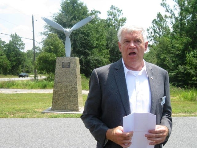 Maj. Gen. Robert Chedister (USAF ret.) speaks in front of the memorial to Hervis Ward during the monument's Aug. 7 dedication at Crestview Technology Air Park.