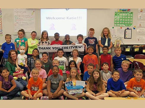 Katie Mitchell and her mother, Jamie, second row, left, visit with students in Jennifer Constantine's third-grade class at Walker Elementary School.