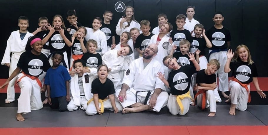 Atlas Martial Arts students have a little fun while taking pictures. [CONTRIBUTED PHOTO]