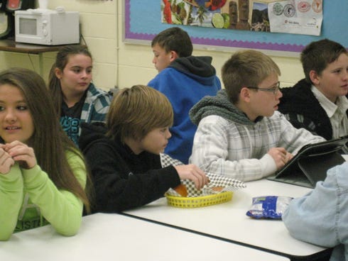 Several Laurel Hill School students have an early breakfast before boarding buses to attend the Alabama Shakespeare Festival’s production of “A Christmas Carol.”