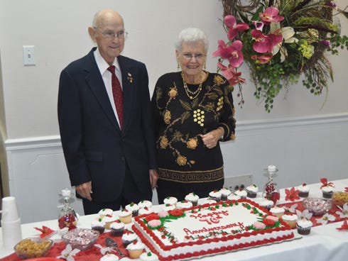 Marlin, 89, and Charlotte Bass, 87, pose next to their cake at the 70th wedding anniversary celebration at First Baptist Church of Crestview.