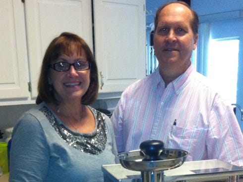 Crestview residents Wanda and Cliff Larson stand next to a juicer, which was purchased with financial support of friends and family members through a fundraising website. Cliff Larson, who was recently diagnosed with cancer in his abdomen, decided to try an alternative form of treatment called Gerson therapy.