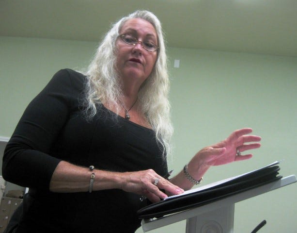 Municipal planner Pat Blackshear addresses a resident’s concern about a requested zoning change to accommodate a proposed branch of the Okaloosa Teachers Federal Credit Union.