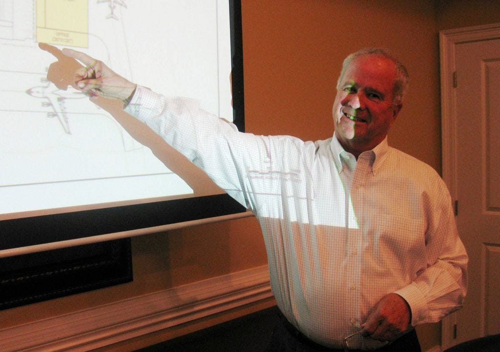 Dennis Mitchell explains Crestview Technology Air Park plans for growth to members of the Crestview Area Chamber of Commerce Airport Committee.