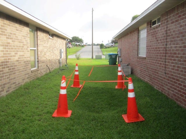 This sinkhole formed between two homes in southwest Crestview last week, caused by a leaking underground drain pipe that channels storm water runoff from the hill opposite the homes.