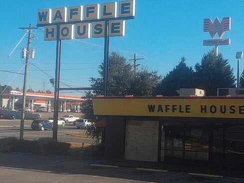 Boards covering windows on the South Ferdon Boulevard Waffle House mask an estimated $10,000 in damage from a weekend wreck.