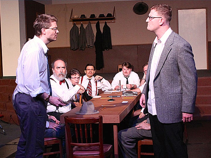 Lincoln Sayger’s Juror #11 stands up to the ethnocentric ranting of Ray Erlacher’s Juror #7 in a scene from “12 Angry Men,” playing through the weekend at Warriors Hall.