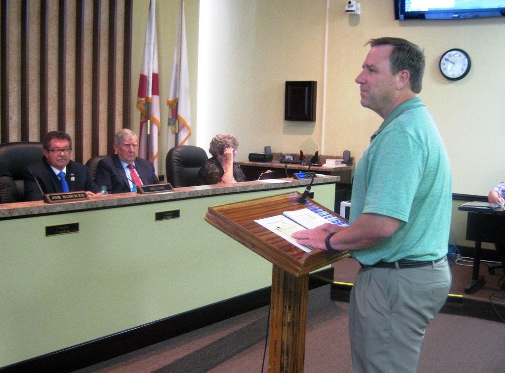 North Okaloosa Amateur Radio Club President Ron Mahn describes his organization's emergency communications capabilities to the Crestview City Council, including Councilman Bill Cox, city attorney Ben Holley and City Clerk Betsy Roy.