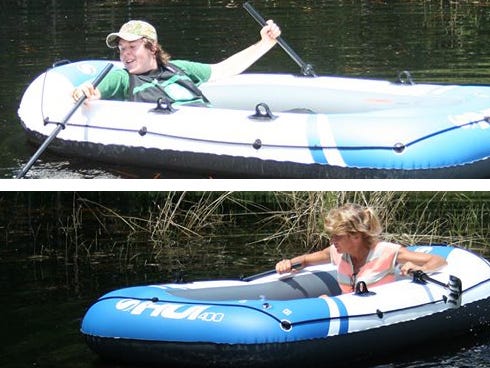 Bama Nettles, left, and his mother, Ann Gregg, right, float on a raft in rainfall that developed a pond of sorts on Wednesday in Gregg’s Crestview backyard.