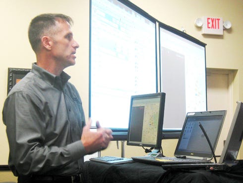 Al Battles, of SunGard Public Sector, demonstrates the company's law enforcement software during an Aug. 20 Crestview City Council workshop. Crestview Police Chief Tony Taylor is requesting $800,000 — spread over six years — to replace the department's outdated computer system.