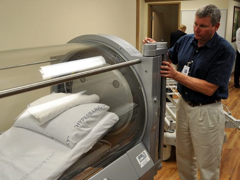 Hyperbaric safety technician Tim Dreyer shows how one of two new hyperbaric chambers works in North Okaloosa Medical Center's new Wound Healing Center.
