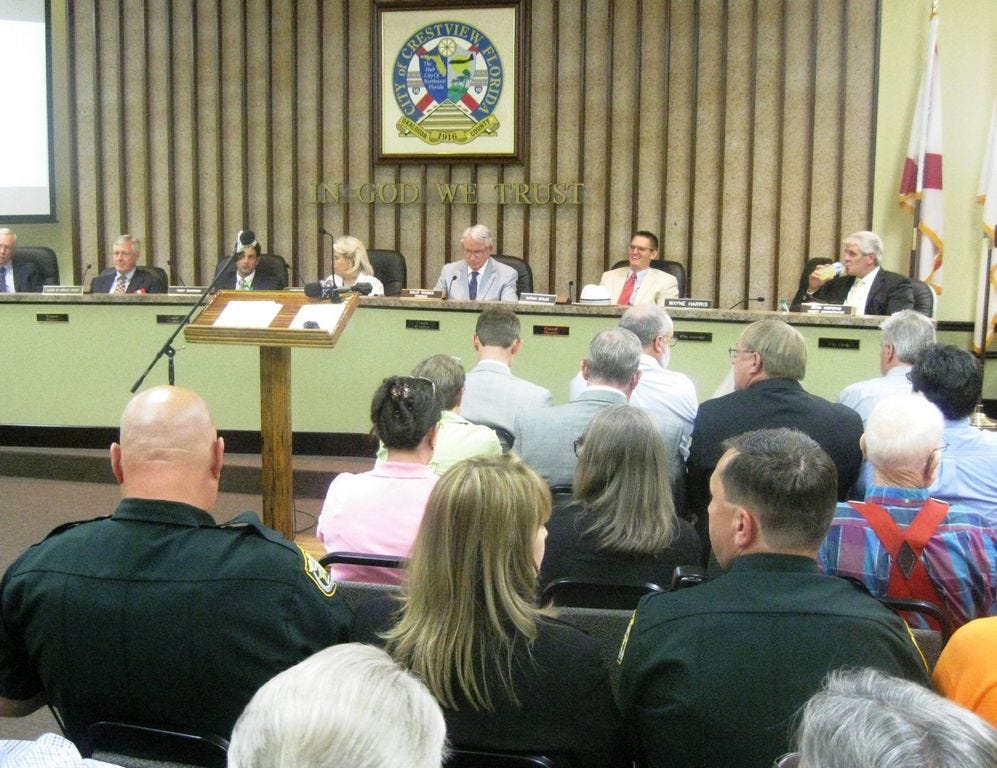 An overflow crowd, including a throng listening to proceedings over a speaker placed in the hallway, attended a special Okaloosa County Board of Commissioners meeting in Crestview called to discuss the new courthouse.