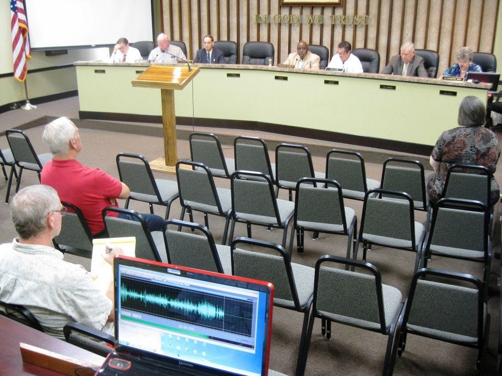 The Crestview City Council faces a largely empty council chamber during Tuesday's millage and budget hearing. Councilmen praised the handful of people who participated in the meeting. “Of four budget workshops, there have only been an average of four citizens attending,” Councilman JB Whitten said, noting more than 200 attended a recent discussion about the Confederate flag.
