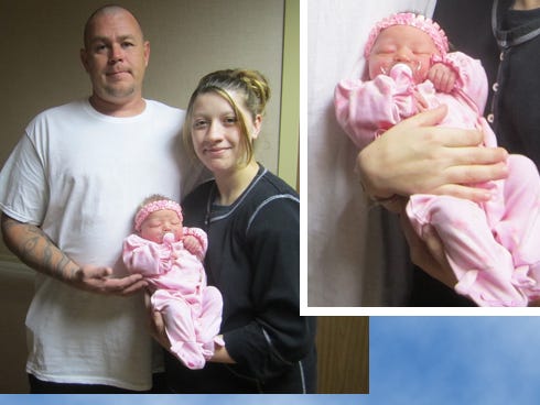 Makayla Olivia Jones, the north county’s first baby of 2013, nestles in the arms of her parents Stephanie Arnold and Mather Jones.
