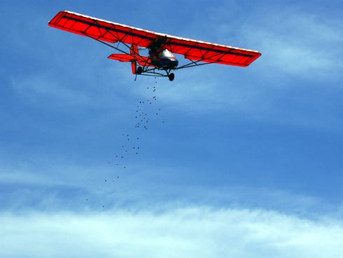 A plane drops Easter eggs during a previous egg drop.