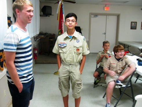 Swedish Boy Scout Axel Borgdén, left, is welcomed by Crestview Boy Scout Troop 773 assistant senior patrol leader Christopher Schultz and his fellow scouts at Monday’s troop meeting.