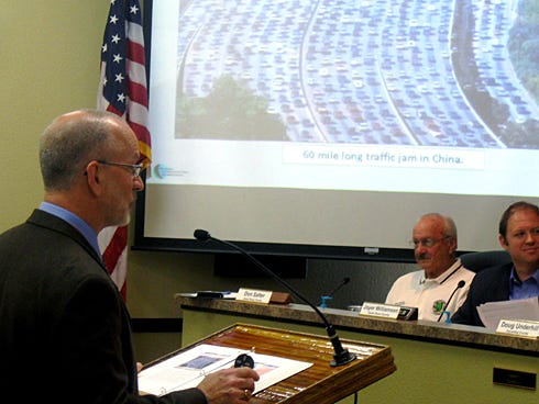 Florida Transportation Commission assistant executive director Mark Reichert uses a photo of a notorious 60-mile long, 11-day traffic jam in China as an extreme example of not planning for road transportation growth.