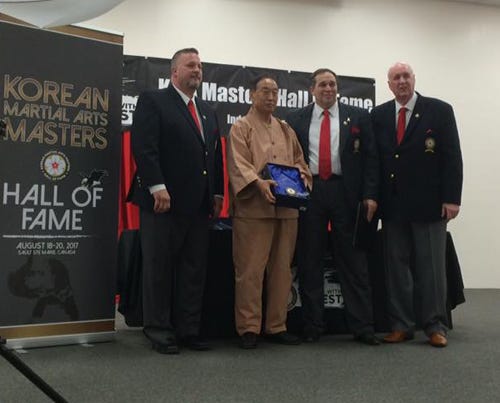 The Korean Martial Arts Festival honored Hall of Fame winners, including Living Legend award winner Dr. Kimm, He-Young during a ceremony Sunday, April 24 at the Warriors Hall in Crestview. Pictured from left are Grand Master Kenneth MacKenzie, Kimm, Thomas Gordon, and Korean Martial Arts Masters Hall of Fame founder Grand Master Rudy Timmerman.