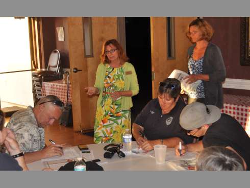 Marylin Dorsey, center, answers questions from midtown neighborhood watch members on Tuesday at Central Baptist Church. Dorsey, a project specialist with Mothers Against Drunk Driving, advised parents to talk to their underage children about alcohol consumption.