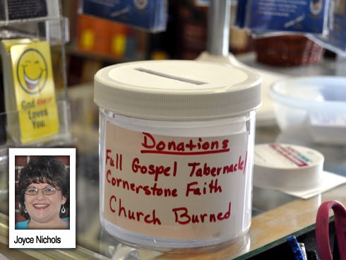 A donation jar for Full Gospel Tabernacle Church’s recovery efforts sits in the Gospel Lighthouse bookstore, 1051 S. Ferdon Blvd., Crestview.