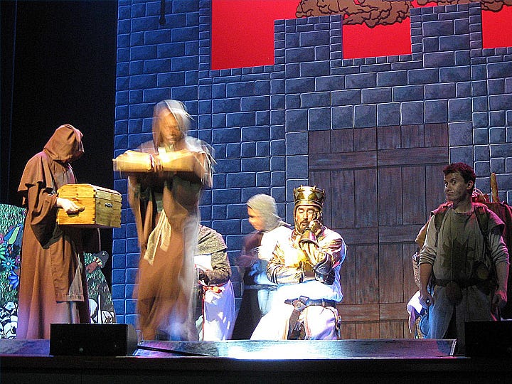 Nick Trolian’s King Arthur expresses his frustration, having told Brother Maynard, played by Javonte Coleman, to “skip a bit” as he read a ponderous passage of the Book of Armament. Stephen Shouse’s Patsy, right, shares his liege’s opinion.
