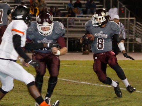 Gator tailback Jalen Ciurleo follows a lead block by Oakley Kinbrell in Baker's opening round playoff game against Graceville. The Gators will try to knock off defending state champion Port St. Joe in the state semifinals Friday night.