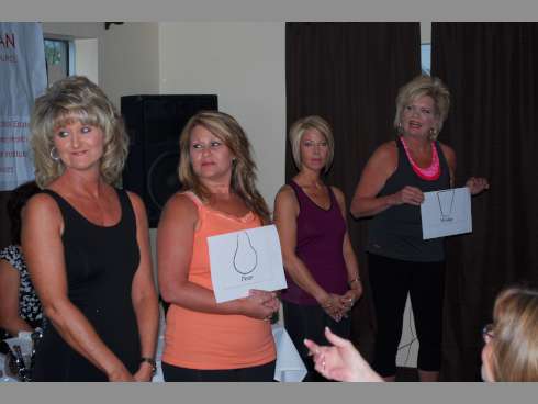Volunteers help with a fashion show during “Making the Most of Me,” a North Okaloosa Medical Center-Healthy Woman event, last month at Christopher's Uncorked Bistro. Part two of the panel event is at 6 p.m. Tuesday at the same location.
