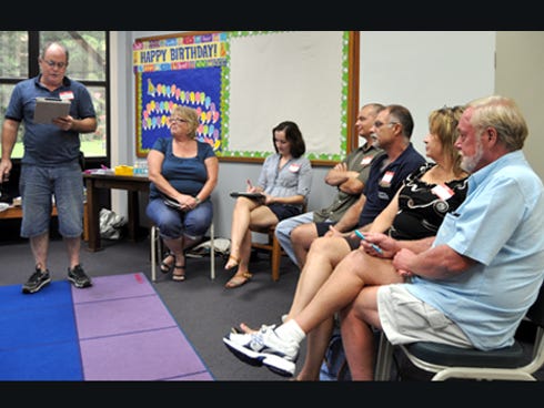 Crestview Photo Club secretary Steve Maloney instructs members on the board election process during the group’s inaugural meeting on Monday at the Crestview Public Library. At right are vice president Terry Maloney, president Mira Crisp, photo challenge coordinator Mike Lane, club members Mark Bean and Cathy Justice and trips coordinator Derl Justice.
