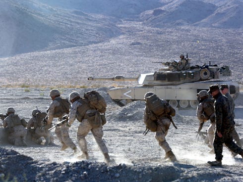 Marines with Alpha Company, 1st Battalion, 7th Marine Regiment, maneuver uprange during a live fire exercise on Range 210 at Marine Corps Air Ground Combat Center Twentynine Palms, Calif., Dec. 6. Staff Sgt. Jeremiah Bergeron of Crestview, a platoon sergeant with Alpha Company, said Range 210 is probably one of the most dynamic ranges in the Marine Corps and it does an excellent job of mimicking a combat environment.