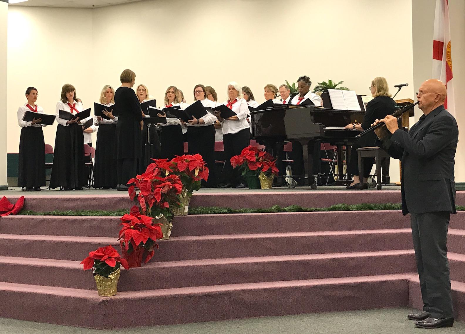 Flautist Steve Ford accompanies the Crestview Community Chorus on “A Winter Carol/Huron Carol” during the chorus’s debut concert Thursday evening. [CONTRIBUTED PHOTO]
