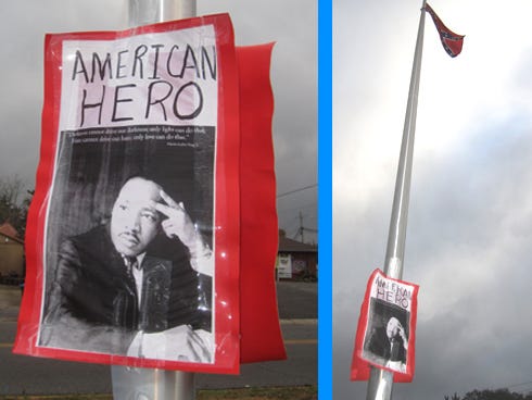 Posters praising Dr. Martin Luther King Jr. are hung on the flagpole on the Uncle Bill Lundy Memorial.