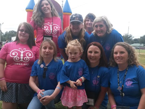 Madison Baxley, 5, center, joins local women with Turner syndrome during Turner Syndrome Family Fun Day on Saturday at Old Spanish Trail Park. The event, which raised awareness for the chromosomal disorder, raised almost $3,000 for Madison’s medical expenses, with 25 percent of proceeds going toward the Turner Syndrome Society of the United States. Back row, from left, are Amanda Pierce, Ashley Zackowski, Stephanie Guy and Marianne Speni. Front row: Chelsee Garrett, Marianna Kalytovska, Madi Baxley, Amber Gallo and Carrie Odom.
