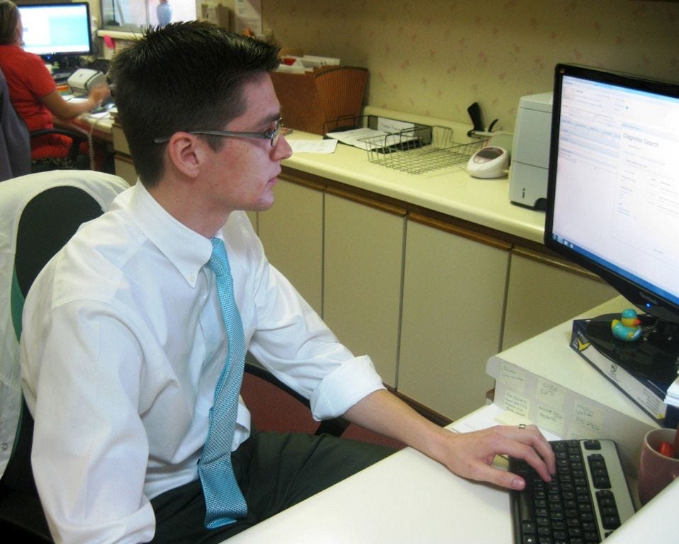 Andrew Linares, an administrator at Crestview surgeon Dr. David Herf’s office, codes a patient’s treatment record using some of the 72,000 new International Classification of Diseases medical procedure codes.