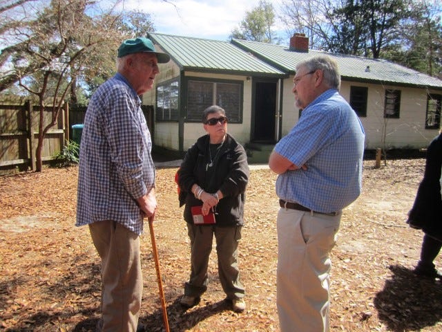 John McMahon, retired forester and founder of the McMahon Environmental Center, chats with Boy Scout Unit Commissioner Rae Schwartz and Crestview Kiwanis committee chairman Jimmy Lundy in front of the center's regional natural history and heritage museum.