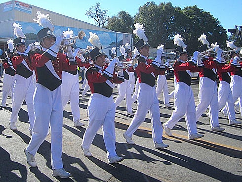 Twenty-seven members of the Crestview High School band, including several of these trumpeters, shown marching in this year’s Veterans Day Parade, will perform in the Okaloosa All-County Band.