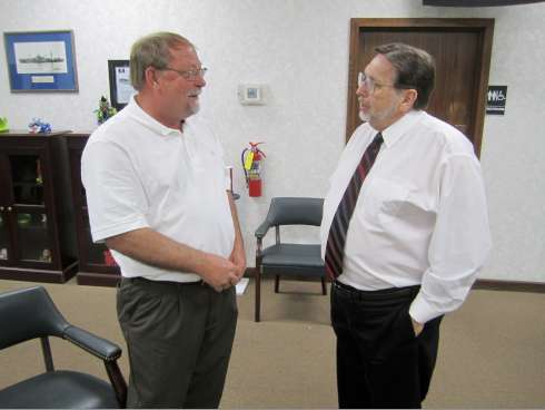Crestview Mayor David Cadle, right, congratulates Mickey Rytman, one of Crestview's newly elected city councilmen following the announcement of Rytman's defeat of incumbent Charles Baugh Jr.