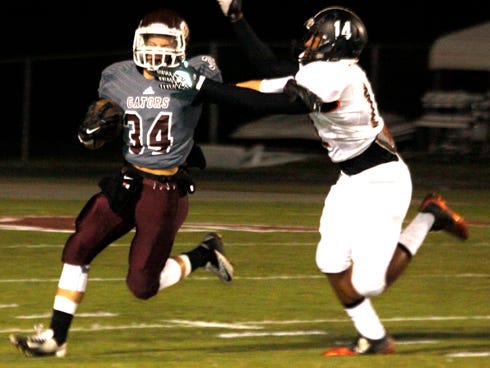 Dillon Nixon returns the opening kickoff for Baker during last week's Region 1-1A semifinal game with Graceville.