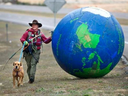 Kentucky resident Erik Bendl and his dog, Nice, are walking across Northwest Florida pushing an inflatable Earth ahead of them to raise money for diabetes organizations and to promote exercise as a way to prevent diabetes.