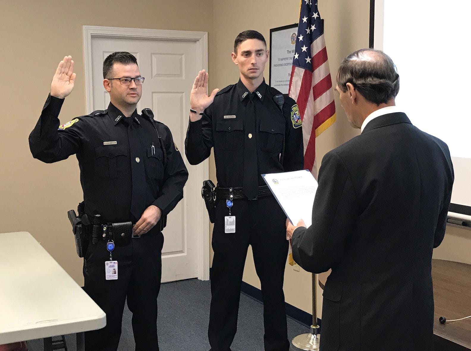 Mayor JB Whitten swears in new Crestview Police Department officers Christopher Anderson (left) and Matthew Currie Dec. 18 in Crestview. [CONTRIBUTED PHOTO]