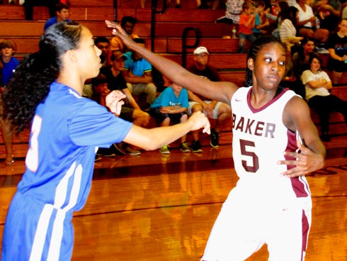 Baker School girls basketball Coach Jamie Kerrell said Alena Banks has the length (of her body) and speed that allows her to excel as a defensive player.