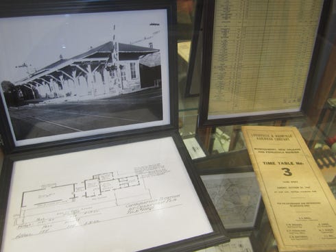 A display at the Crestview Public Library includes a photo and floor plan of the former Crestview rail depot and local timetables.