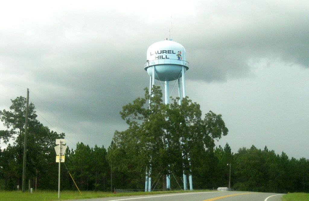Laurel Hill's water tank greets visitors as they arrive in town from south State Road 85. The City Council is considering raising water rates to plan for future growth and infrastructure repairs.